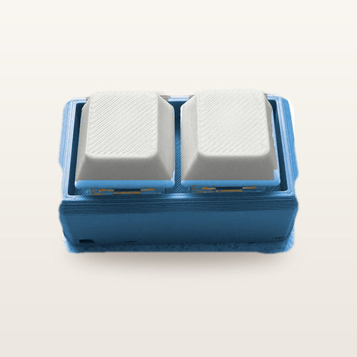Clickey Duo met blauwe basis en witte keycaps