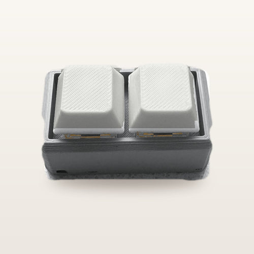 Clickey Duo met grijze basis en witte keycaps